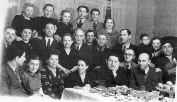 Photograph of Belchatow survivors at a meal.